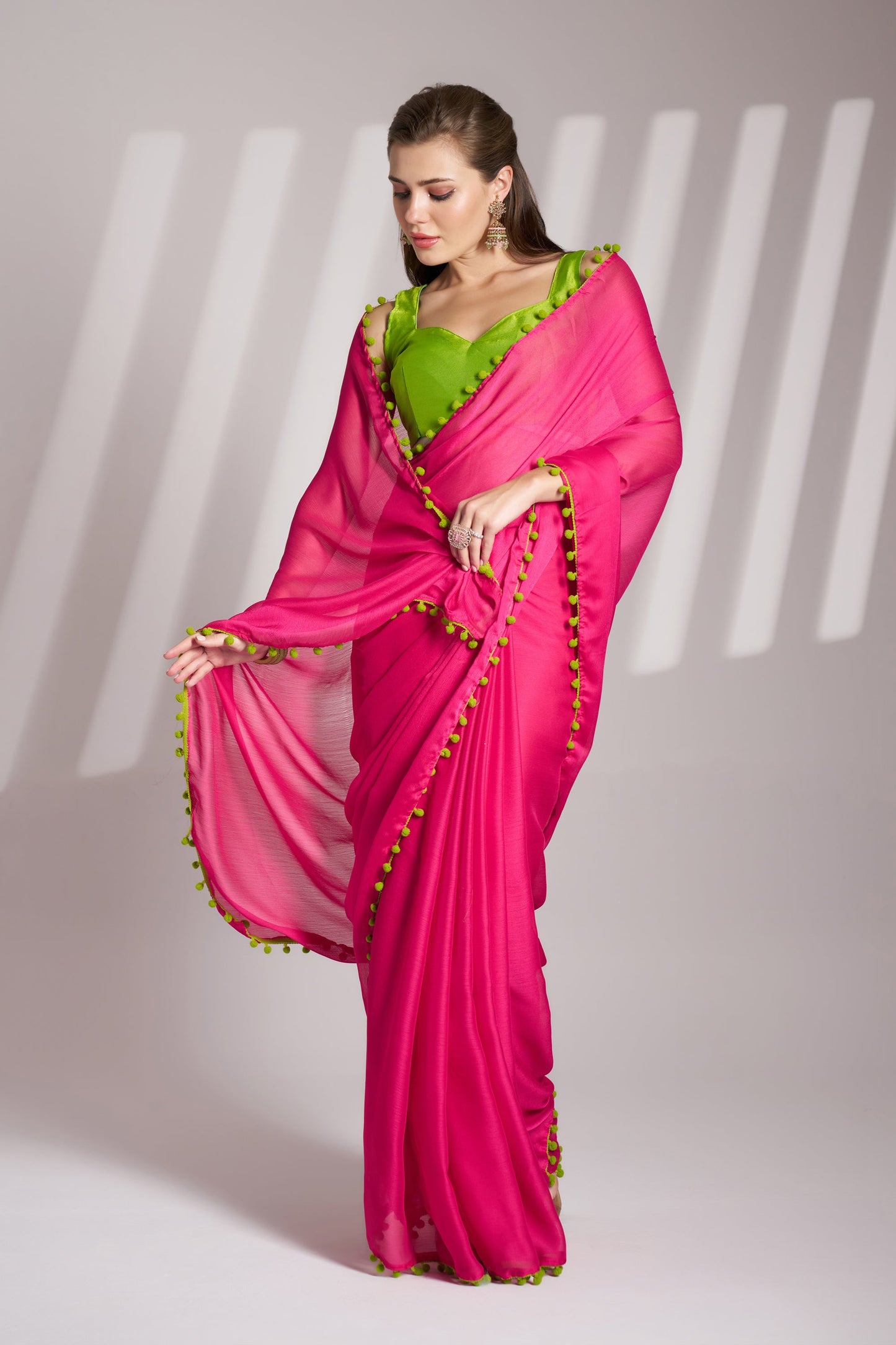 Pink color chiffon fabric saree with designer lace and unstitched blouse